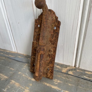 May include: A rustic wooden sign with the text "Welcome to our home" in white lettering. The sign has a distressed finish and a simple, inviting design, ideal for front door decor.