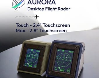May include: Two Aurora Desktop Flight Radar devices with green digital radar displays. One unit is beige and the other is dark blue. Text reads: AURORA Desktop Flight Radar, Touch - 2.4" Touchscreen, Max - 2.8" Touchscreen. Each screen shows flight data.