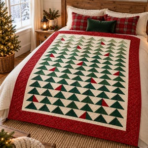 May include: A rectangular quilt featuring a repeating pattern of dark green and cream-colored triangles arranged to resemble pine trees, with scattered red triangles throughout. The quilt has a wide red border with a subtle tonal floral pattern.