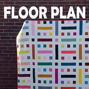 May include: A white fabric with a colourful geometric pattern of squares and rectangles. The fabric is folded and leaning against a brick wall. The text "FLOOR PLAN" is at the top of the image. A circle with the text "KRISTY DAUM" is in the bottom left corner.