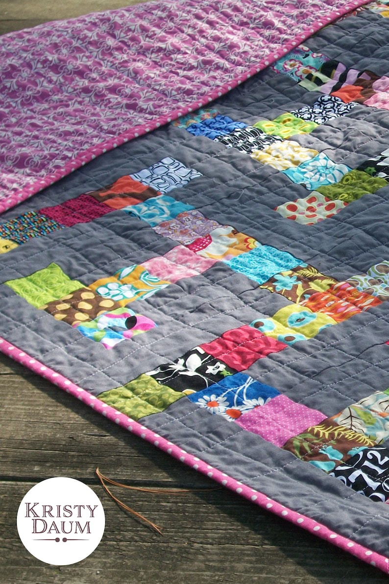 modern quilt made up of colorful scrappy squares