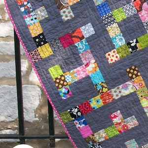 modern quilt made up of scrappy colorful squares