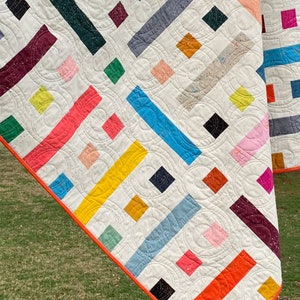modern quilt made up of colorful squares and rectangles titled floorplan