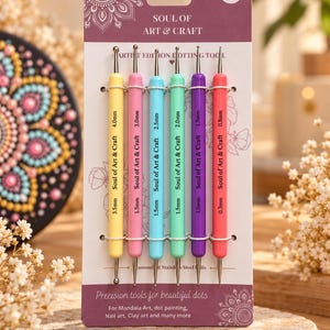 May include: A set of 6 double-ended dotting tools on a purple card labeled Soul of Art & Craft. The tools feature colorful handles in yellow, pink, blue, green, purple, and red, with metal ball tips ranging from 0.3mm to 4.0mm in size.
