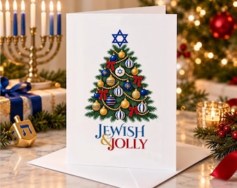 May include: A white greeting card featuring a green pine tree illustration decorated with blue, gold, and white ornaments, red bows, and a blue Star of David at the top. The text below the tree reads JEWISH & JOLLY in blue and red lettering.