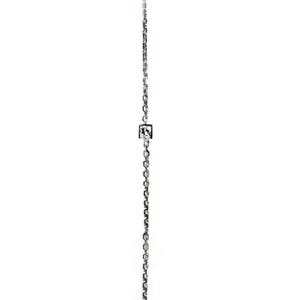 May include: A silver chain necklace with a small square pendant featuring a clear crystal.