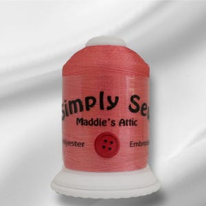 May include: A spool of coral pink embroidery thread with the text "Simply Sew Maddie's Attic" and a red button graphic.