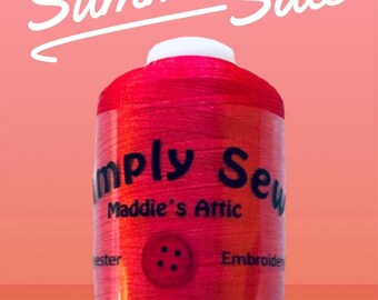 May include: A spool of red embroidery thread with the label "Simply Sew Maddie's Attic" and the words "Polyester" and "Embroidery" on the label.