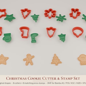 Könnte beinhalten: Ein Set aus acht roten Kunststoff-Ausstechformen und acht passenden grünen Stempeln in weihnachtlichen Motiven wie Sternen, Tannenbäumen, Schneeflocken, Lebkuchenmännern, Fäustlingen, Strümpfen, Glocken und Kugeln, inklusive vier Keksbeispielen.