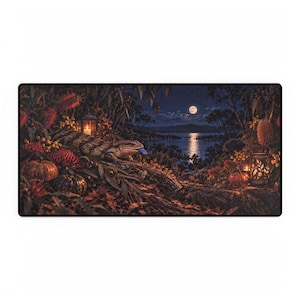 May include: A rectangular desk mat featuring a detailed illustration of a blue-tongued skink resting on a log at night. The scene includes a full moon over a lake, glowing lanterns, pumpkins, and autumn foliage in shades of orange, red, and brown.