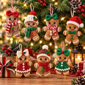 May include: A collection of seven crocheted gingerbread ornaments featuring various accessories including red and green scarves, hats, and dresses. Each figure has a brown body, black eyes, and white button details, suspended by loops.