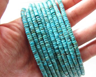 May include: A strand of turquoise beads, with a light blue colour, in a rectangular shape. The beads are stacked on top of each other, creating a layered effect.