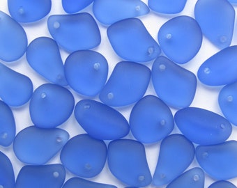 May include: A collection of light blue glass beads with a frosted finish. Each bead has a small hole for stringing.