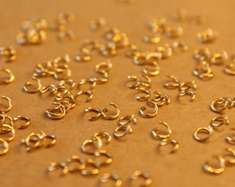 100 pc. 4mm Gold Plated Stainless Steel Jumprings, 22 gauge | FI-649