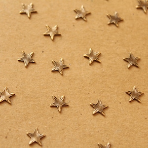 10 pc. Tiny Antique Brass Plated Textured Stars: 6.5mm diameter - made in USA | AB-030