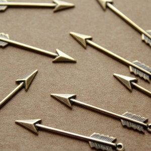 4 pc. Medium Antique Brass Plated Arrows: 33mm by 5mm - made in USA | AB-094