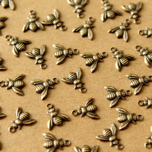 12 pc. Tiny Antique Brass Plated Bee Charms: 8mm by 6mm - made in USA | AB-309