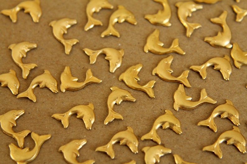 14 pc. Tiny Raw Brass Dolphins: 10mm by 8.5mm made in USA RB-265 image 1