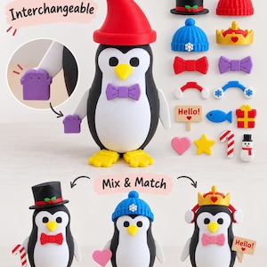 May include: A penguin figurine with interchangeable accessories including hats, bow ties, and handheld items. The set features a black and white penguin, a red hat, a blue beanie, a crown, and various small colorful pieces with text reading Hello.