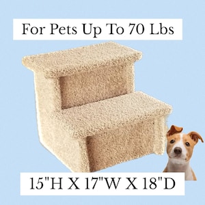 May include: Beige two-step pet stairs with a soft, plush surface. The stairs are 15 inches high, 17 inches wide, and 18 inches deep. "For Pets Up To 70 Lbs" is written on the top of the image.