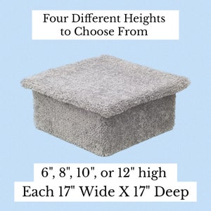 May include: A square, light gray, carpet-covered platform with a textured surface. Text above reads: Four Different Heights to Choose From. Text below reads: 6", 8", 10", or 12" high. Each 17" Wide X 17" Deep. The object has a flat top and vertical sides.