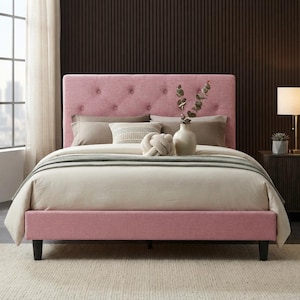 May include: A pink upholstered bed frame featuring a tufted headboard with button detailing and dark tapered legs. The bed is dressed with a light beige comforter, several neutral-toned pillows, and a decorative knot-shaped cushion.