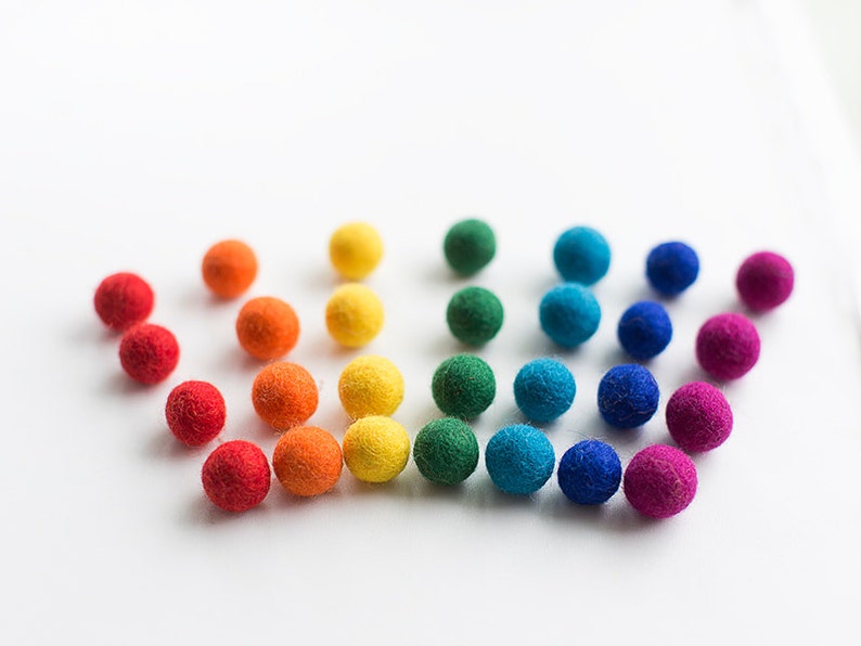 50 felt wool balls 1/2 in. size rainbow mix red orange yellow green turquoise blue purple image 1