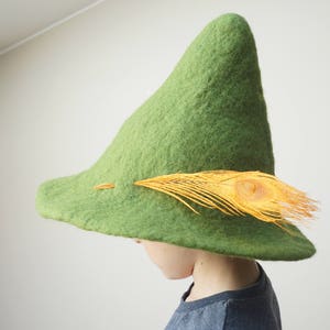 Hand felted Snufkin inspired hat - perfect festival, holiday or sauna accent! Also can serve as Leprechaun or Joxter (if in red option) hat! Hat can be decorated with goose or peacock feather - according to your choice.