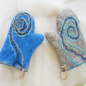 May include: Two oven mitts with a spiral design. One mitt is blue with black and light blue stitching. The other mitt is gray with dark blue and light blue stitching.