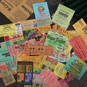 Rock ticket-style stickers arranged for scrapbooking