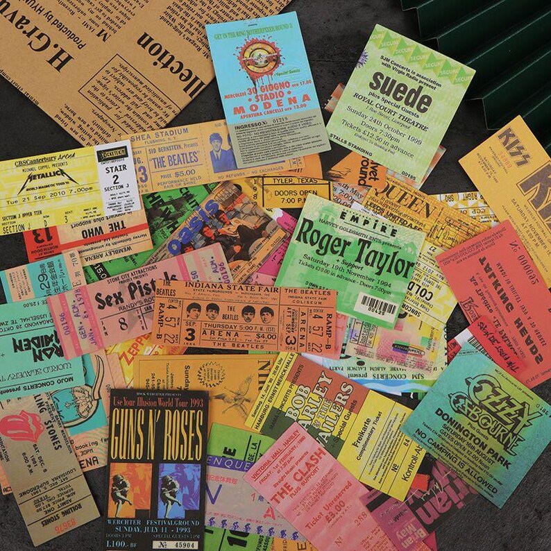 Rock ticket-style stickers arranged for scrapbooking