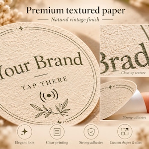 May include: A round, beige, textured paper sticker featuring the text Your Brand and TAP THERE with a wireless signal icon and leaf graphic. The sticker has a dark border, a peelable adhesive backing, and a natural vintage finish.