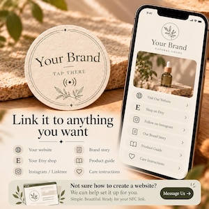 May include: A round, beige NFC tag with the text Your Brand, Tap There, and a signal icon, next to a smartphone displaying a menu with links to a website, Etsy shop, Instagram, brand story, product guide, and care instructions.
