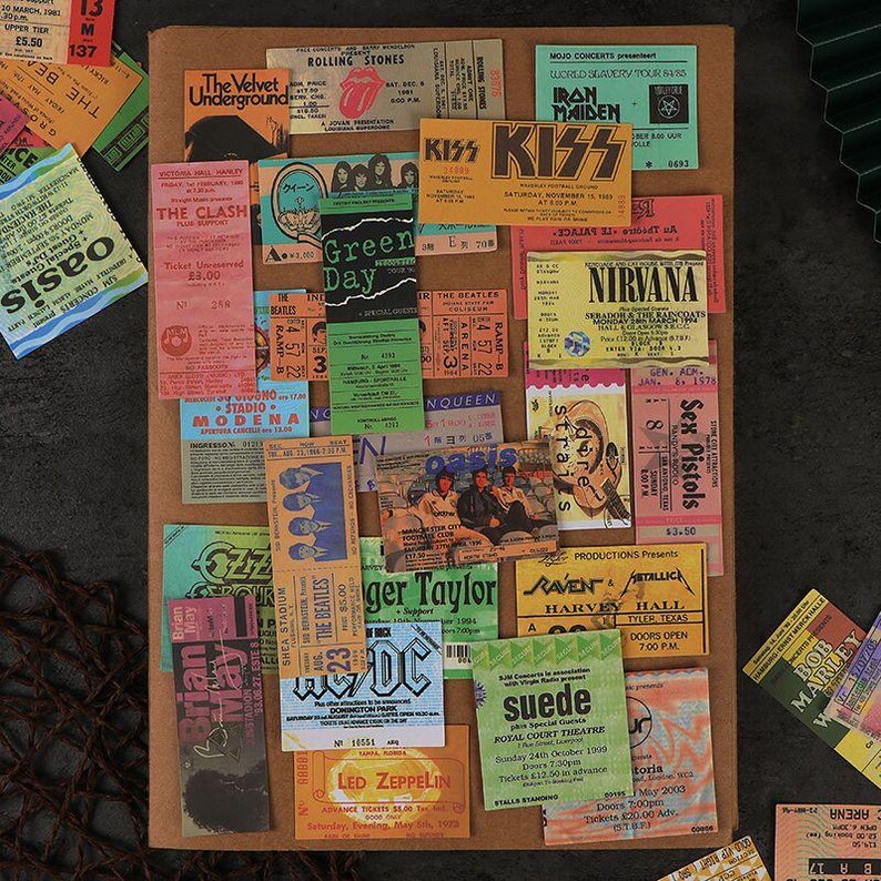 Rock ticket sticker collage on a journal