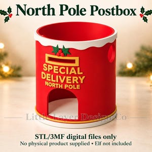 May include: A cylindrical red North Pole postbox container with a white scalloped top edge, a yellow mail slot, and a yellow archway opening. The text reads SPECIAL DELIVERY NORTH POLE. It features green holly leaves and red berries above the slot.