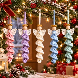 May include: Five hanging angel ornaments featuring crocheted spiral bodies in pink, lavender, cream, light blue, and mint green. Each angel has a round wooden bead head, a small gold-toned halo, and white crocheted wings with a central pearl accent.