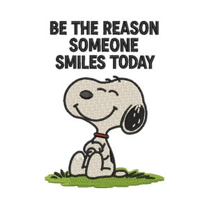 May include: An embroidery design featuring the white cartoon dog Snoopy sitting on a patch of green grass. Above the character, the black text reads: BE THE REASON SOMEONE SMILES TODAY. The dog has a black nose, black ears, and a red collar.