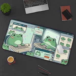 May include: A rectangular desk mat featuring a digital illustration of green frogs using computers. The design includes chat windows with text reading PEEK-A-BOO, HI! CHAT?, and MY FILES, alongside icons labeled POND, FLY LOG, and NOTES on a light background.