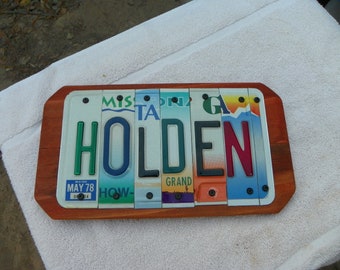 6 letter name plaque made with recycled license plate letters on repurposed redwood