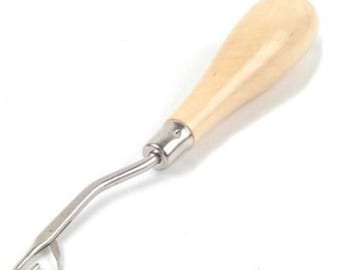 May include: A wooden handled crochet hook with a metal hook. The hook is bent at a 90 degree angle.