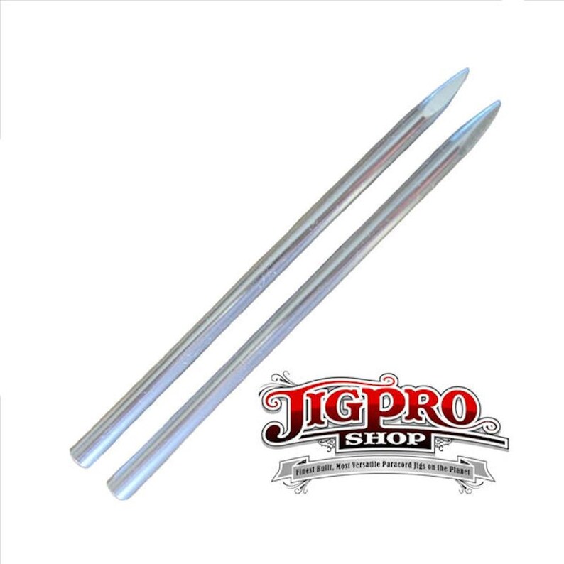 May include: Two silver metal dowel rods with pointed ends. The rods are approximately 6 inches long.