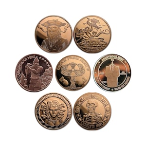 May include: Seven round copper coins with various designs. The coins feature a pirate, an octopus, a man with a shovel, a mushroom with a radiation symbol, a man in a suit, a woman with snakes for hair, and a skeleton. The coins have text on them, including "Anonymous Mint", "Dead From Above", "Memento Mori", and "We Do Not Forgive".