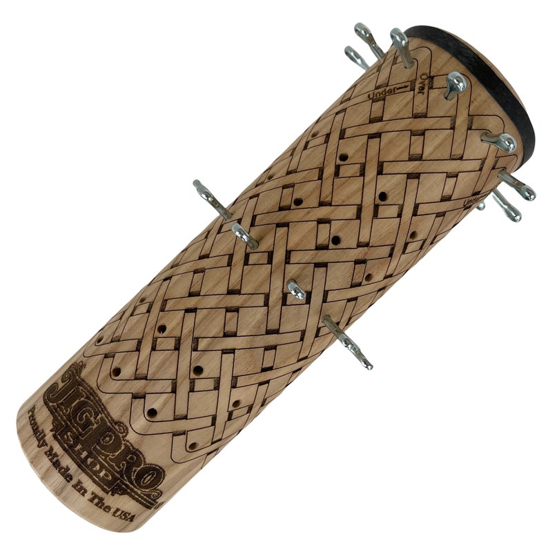 May include: A wooden knitting needle holder with a woven pattern and metal pins. The holder is labeled "JigPro" and "Family Made in the USA".