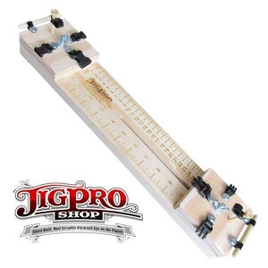 May include: A wooden jig with a ruler marked in inches and a clamping mechanism. The jig is labeled "JigPro Shop" and "Finest Built. Most Versatile Paracord Jigs on the Planet".