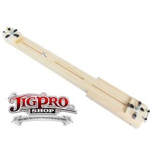 May include: A wooden jig with two parallel tracks and adjustable clamps. The jig is designed for woodworking projects and is labeled "JigPro Shop: Finest Built, Most Versatile Paracord Jigs on the Planet."