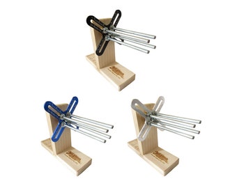 May include: Three wooden bases with a metal jig for making picture frames. The jigs are black, blue, and silver. Each jig has five metal rods extending from the center.