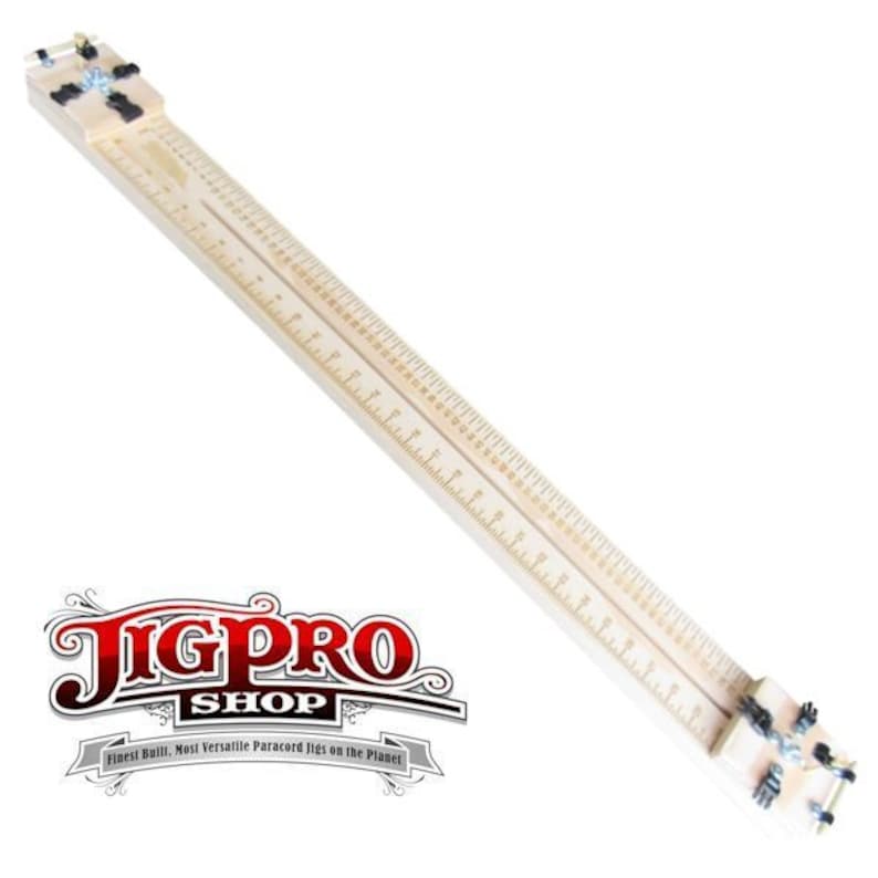 May include: A wooden jig with a ruler and clamps. The jig is used for woodworking projects. The jig is made by JigPro Shop.