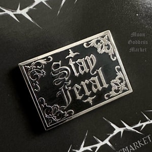 Original copyright Stay Feral Lapel Pin Silver and Black | Gothic Vibes | Dark Fashion |  by Moon Goddess Market  | Handmade gift