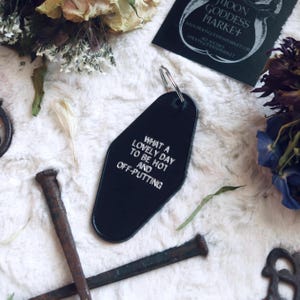 What a lovely day to be Hot and Off Putting | Moon Goddess Market | Motel Hotel Keychain | Goth | Sassy | Handmade gift