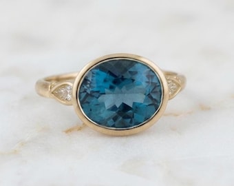 Oval London Blue Topaz Diamond Ring: 14K Yellow Gold Bezel Setting